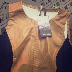 Tan dress with black stripes.